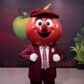 Maroon Apple mascot costume character dressed with Polo Shirt and Tie pins