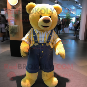 Lemon Yellow Teddy Bear mascot costume character dressed with a Flannel Shirt and Suspenders