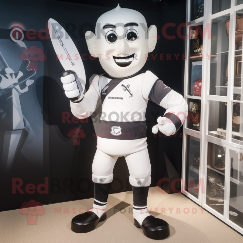 White Knife Thrower mascot costume character dressed with a Rugby Shirt ...