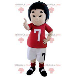 Mascotte de petit garçon habillé en tenue de footballeur -