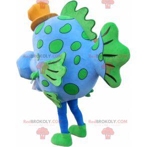 Mascotte de poisson bleu et vert avec un chapeau -