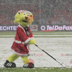 Mascota del león amarillo vestida como Santa Claus -