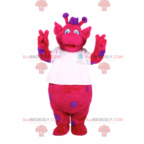 Mascotte de personnage fushia avec des taches violettes -