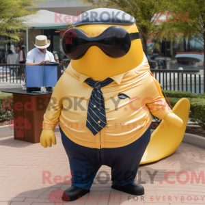 Guld pukkelhval maskot...
