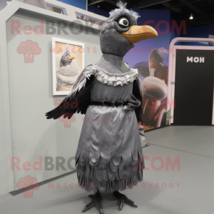 Silver Blackbird mascot costume character dressed with a Dress and Lapel pins