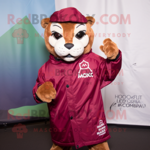 Maroon Mountain Lion mascot costume character dressed with a Raincoat and Cufflinks