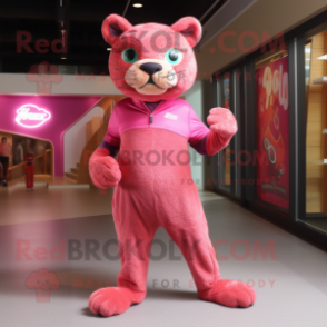 Pink Jaguarundi mascot costume character dressed with a Graphic Tee and Shoe laces