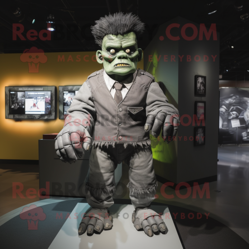 Gray Frankenstein'S Monster mascot costume character dressed with a Suit  and Gloves