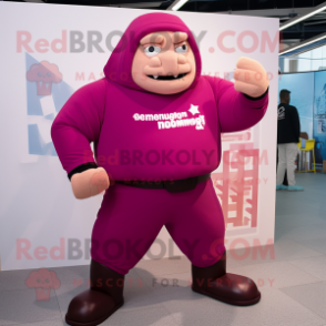 Magenta Strongman mascot costume character dressed with a Hoodie and Cufflinks