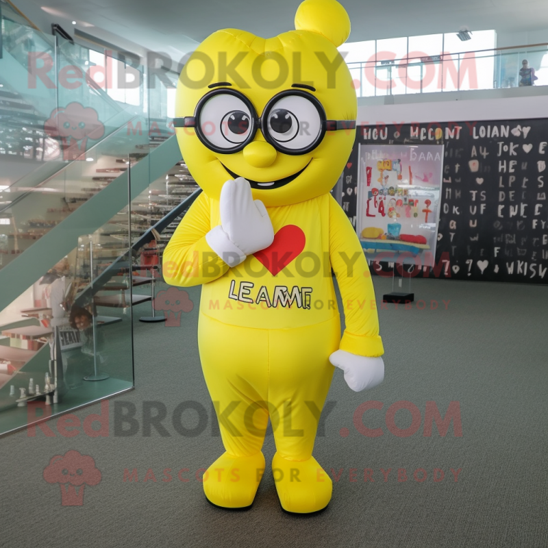 Lemon Yellow Heart mascot costume character dressed with a Jumpsuit and Reading glasses