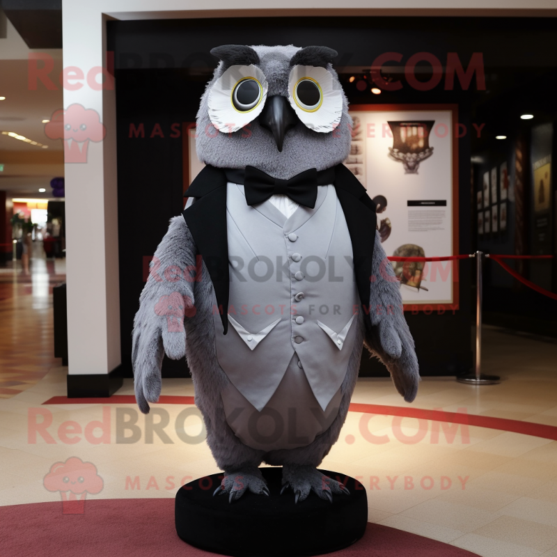 Gray Owl mascot costume character dressed with a Tuxedo and Cummerbunds