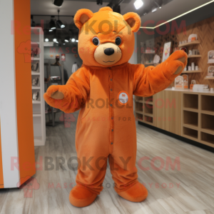 Orange Teddy Bear mascot costume character dressed with a Jumpsuit and Mittens