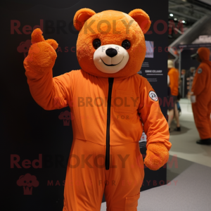 Orange Teddy Bear mascot costume character dressed with a Jumpsuit and Mittens