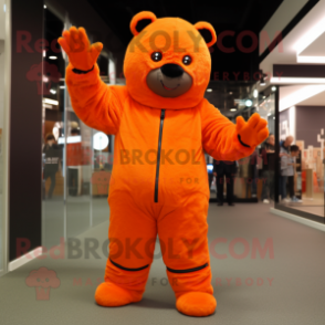 Orange Teddy Bear mascot costume character dressed with a Jumpsuit and Mittens