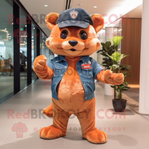 Peach Jaguarundi mascot costume character dressed with a Flare Jeans and Berets