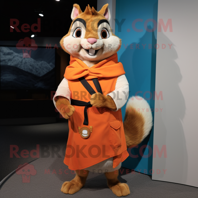 Orange Chipmunk mascot costume character dressed with a Bermuda Shorts and Shawl pins