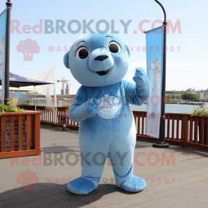 Sky Blue Sea Lion mascot costume character dressed with a Chambray Shirt and Earrings