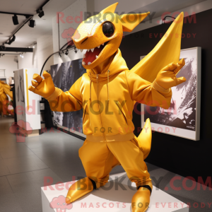 Maskot karakter af en guld...