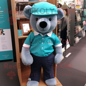 Teal Teddy Bear mascot costume character dressed with a Polo Tee and Pocket squares