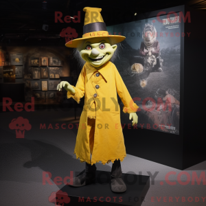 Maskotfigur af en gul...