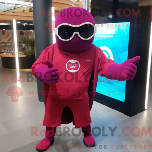 Maskotfigur af en magenta...
