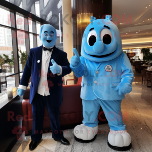 Blue Dim Sum mascot costume character dressed with a Suit Jacket and Watches