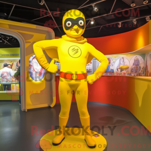 Maskotfigur af en citrongul...