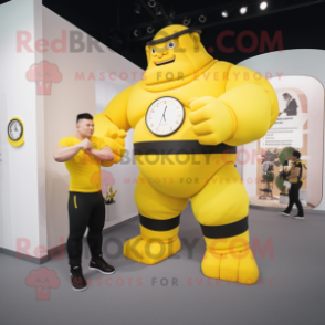 Yellow Strongman mascot costume character dressed with a T-Shirt and Smartwatches