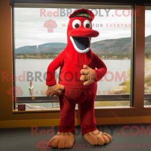 Mascot character of a Red Loch Ness Monster dressed with a Corduroy Pants and Hat pins