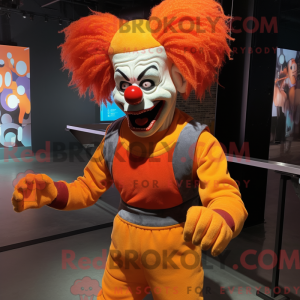 Mascot character of a Orange Evil Clown dressed with a Jeggings and Suspenders
