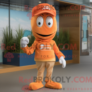 Mascot character of a Orange Shrimp Scampi dressed with a Chinos and Caps
