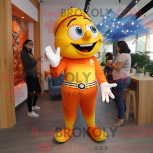 Mascot character of a Yellow Clown Fish dressed with a Mom Jeans and Bracelet watches