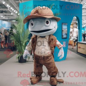 Mascot character of a Brown Swordfish dressed with a Boyfriend Jeans and Hat pins