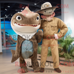 Mascot character of a Brown Swordfish dressed with a Boyfriend Jeans and Hat pins