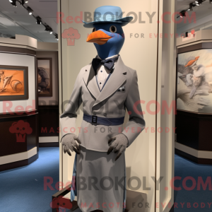 Mascot character of a Silver Passenger Pigeon dressed with a Suit and Berets