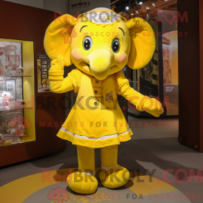 Mascot character of a Yellow Elephant dressed with a Mini Skirt and Headbands