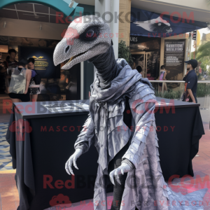 Mascot character of a Silver Velociraptor dressed with a Graphic Tee and Shawls