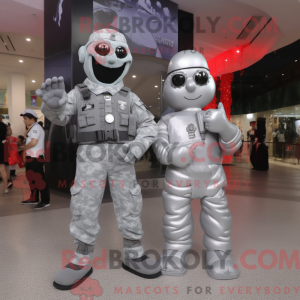 Mascot character of a Silver Para Commando dressed with a Evening Gown and Keychains