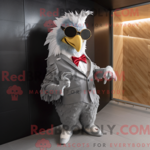 Mascot character of a Gray Rooster dressed with a Blazer and Sunglasses