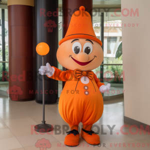 Mascot character of a Orange Magician dressed with a Chinos and Keychains