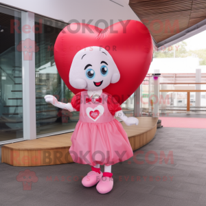 Pink Heart mascot costume character dressed with a Blouse and Foot pads