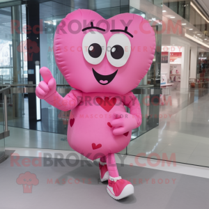 Pink Heart mascot costume character dressed with a Blouse and Foot pads