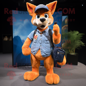 Orange Dingo mascot costume character dressed with a Denim Shorts and Messenger bags