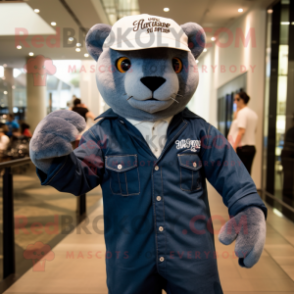 White Jaguarundi mascot costume character dressed with a Denim Shirt and Hat pins