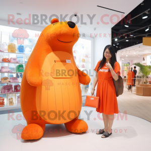 Orange Capybara mascot costume character dressed with a A-Line Dress and Messenger bags