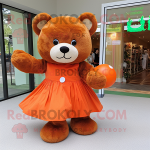 Orange Teddy Bear mascot costume character dressed with a Ball Gown and Tote bags