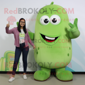 Tan Cucumber mascot costume character dressed with a Mom Jeans and Smartwatches