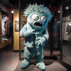 Cyan Frankenstein'S Monster mascot costume character dressed with a Corduroy Pants and Scarves