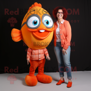 Peach Clown Fish mascot costume character dressed with a Mom Jeans and Eyeglasses