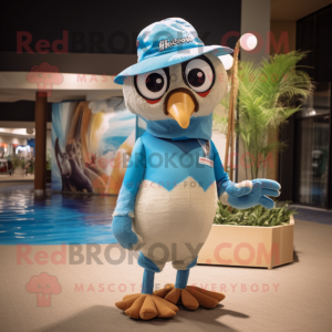 Tan Blue Jay mascot costume character dressed with a Swimwear and Caps